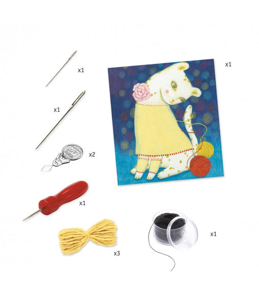 Weven met wol. Trui en pompons.